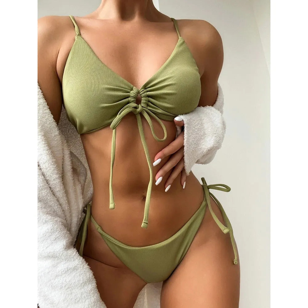 Women's solid colour drawstring bikini set in army green, showing briefs style and backless design for swimming.