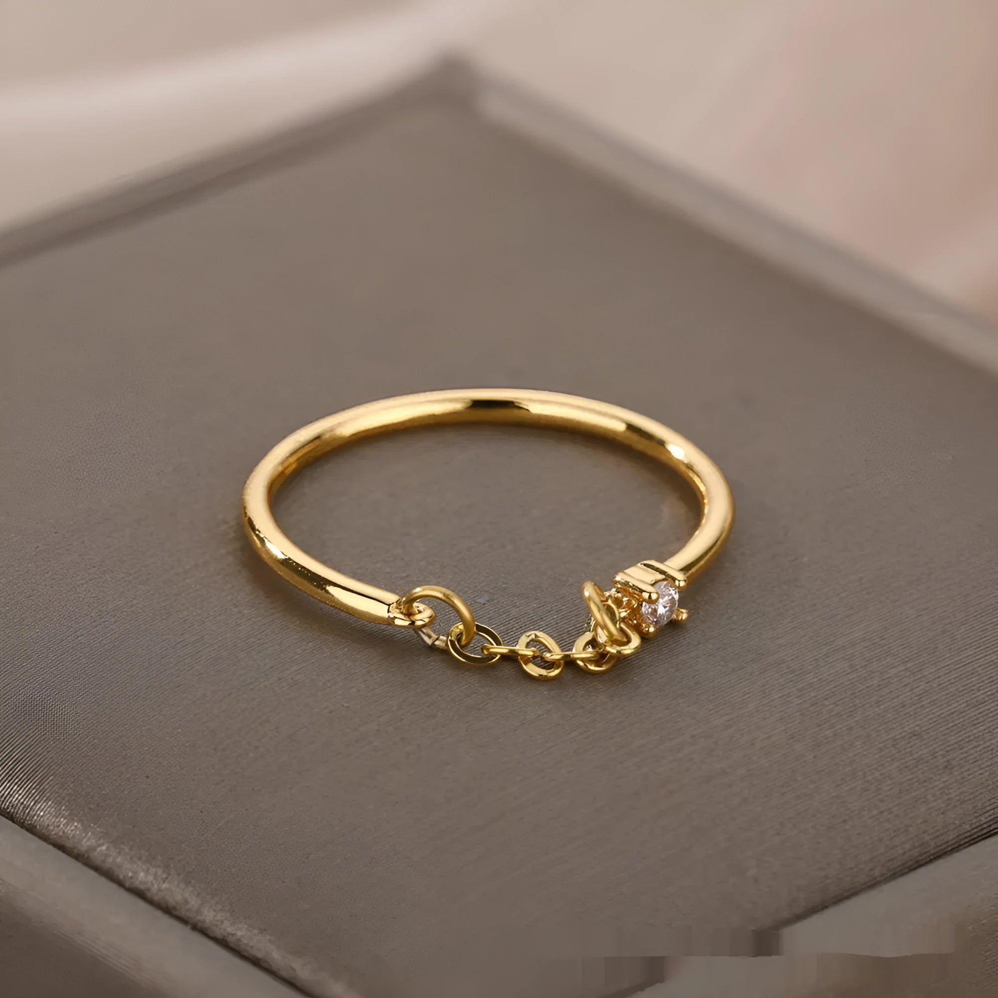 Double-layer cross frame ring in stainless steel, wave shaped, unisex style with electroplated finish available in multiple colours