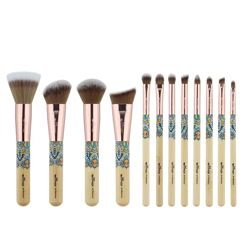 12 makeup brushes with man-made fibre bristles and wooden handles, arranged on a flat surface