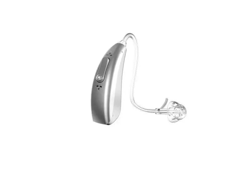 A small, wireless invisible hearing aid and its portable USB charging case.