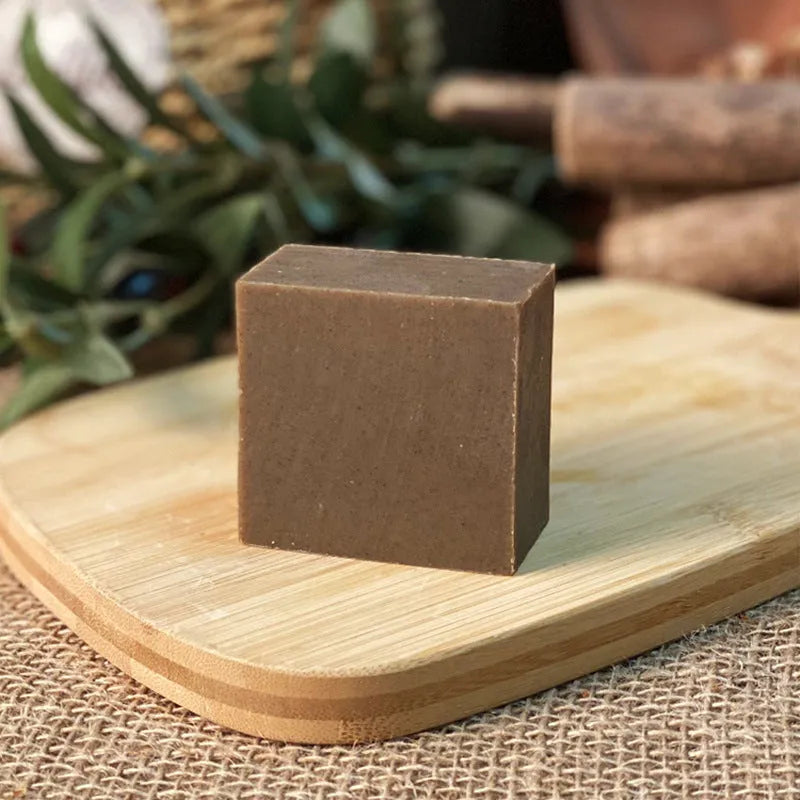 A single 72-gram bar of nine herb cold process shampoo soap for oil-free hair washing.