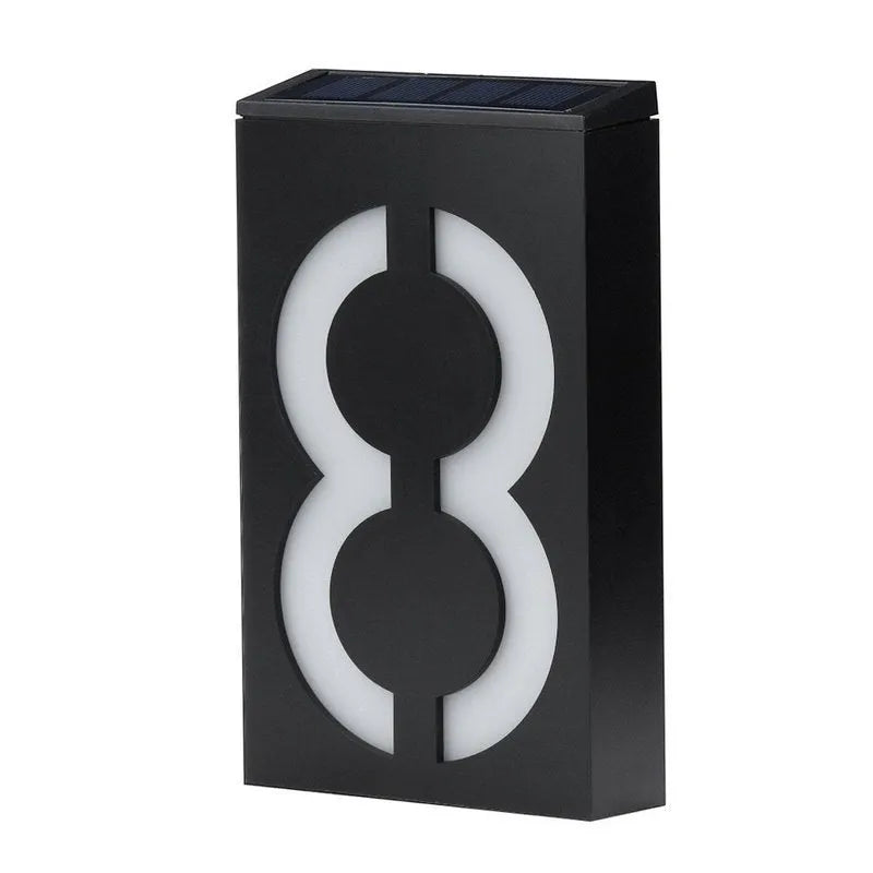Solar powered outdoor house number light with LED illumination and concealed mounting design