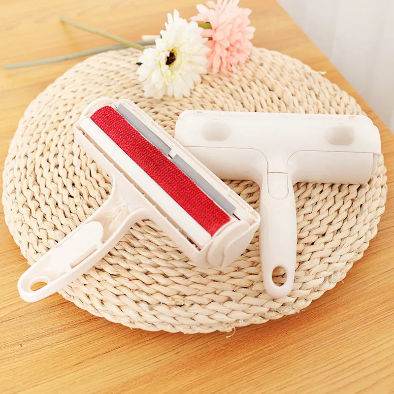 White plastic roller brush pet hair remover with sticky roller surface