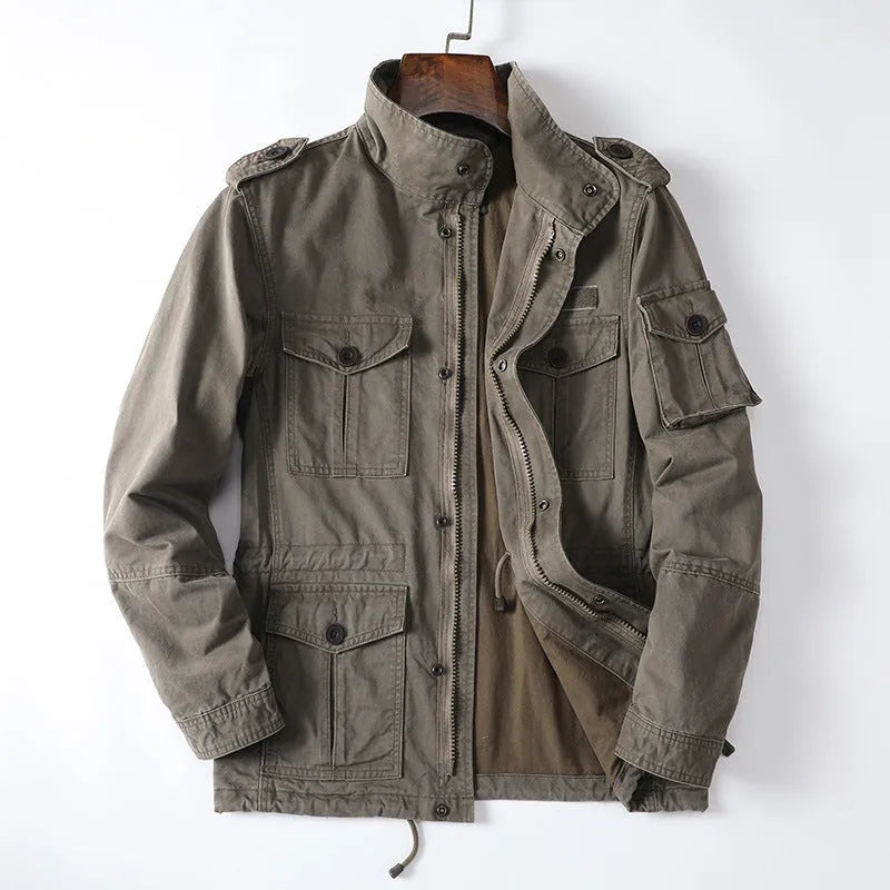Man wearing a light brown loose-fit cotton zip-up jacket, retro casual style.