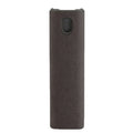 Small blue screen cleaner bottle with attached microfiber cloth on a table next to a smartphone
