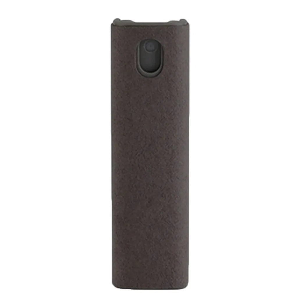 Small blue screen cleaner bottle with attached microfiber cloth on a table next to a smartphone