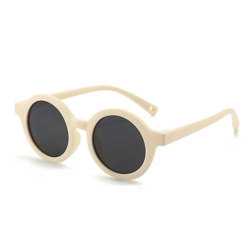 Children's round sunglasses for 0-3 year olds with UV400 protection, shown in a selection of colours.