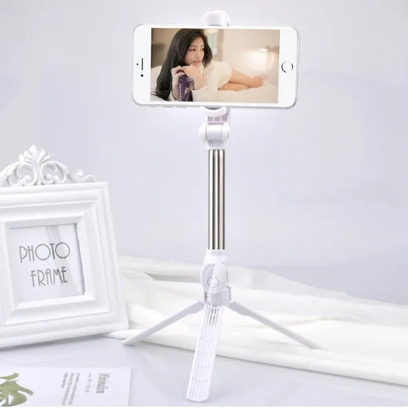 Bluetooth tripod selfie stick with remote control extended to 763mm length showing phone clip rotation