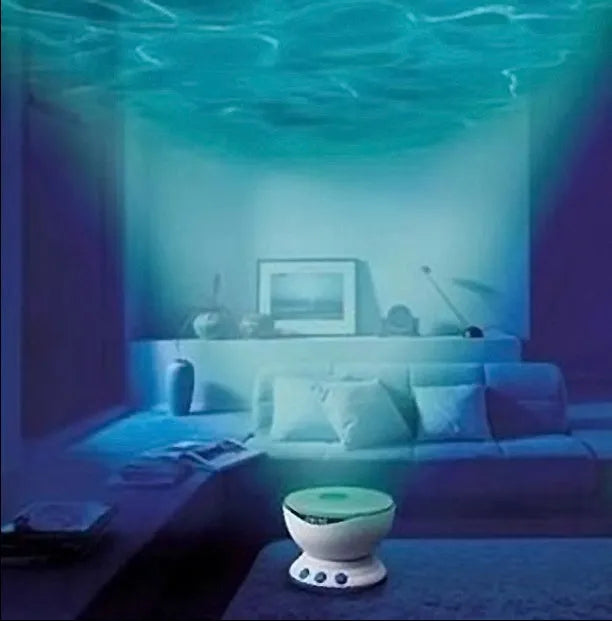 Blue ocean theme LED projection lamp for children's rooms on a table.
