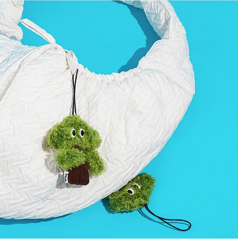 Green pine tree shaped cat toy with hanging loop for biting and interactive play