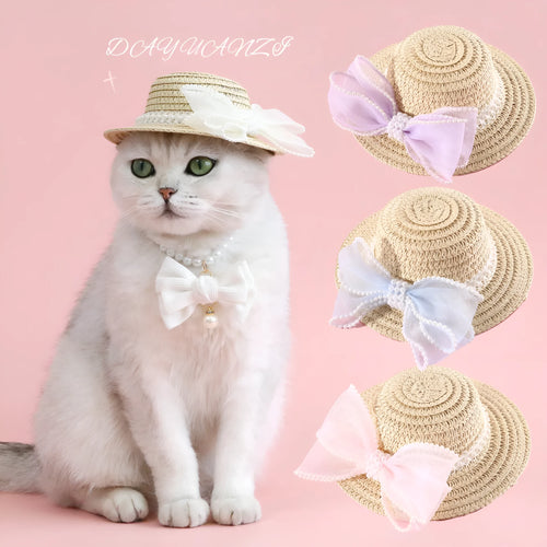 Cat wearing a woven straw hat with a pearl bow decoration in a princess style.