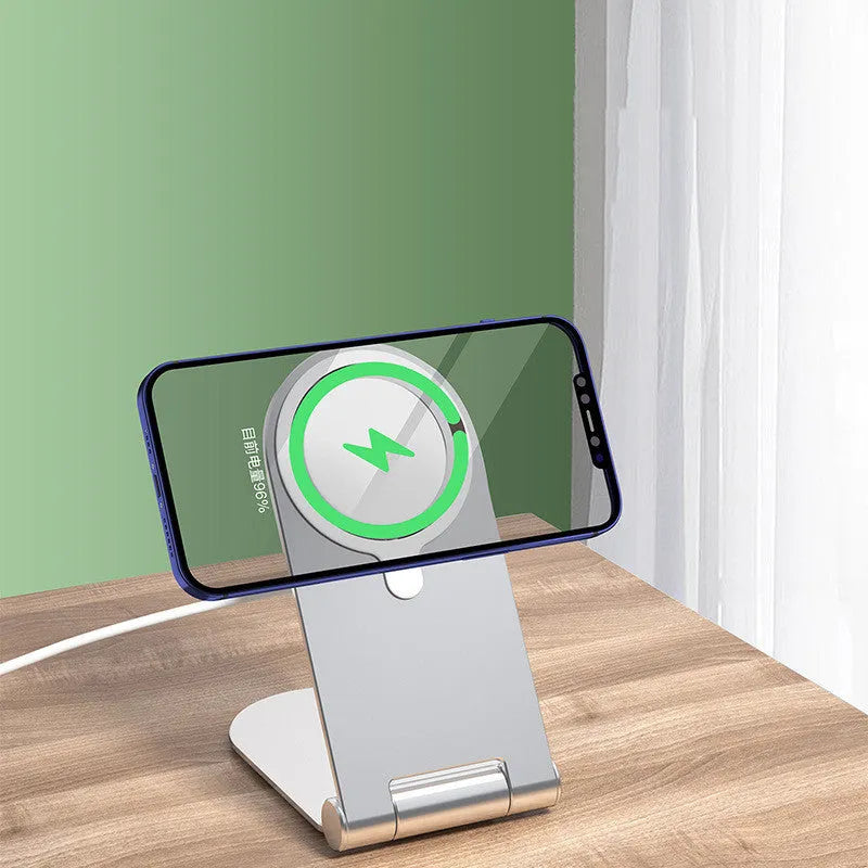 Silver aluminium alloy magnetic phone bracket for iPhone 12 showing adjustable vertical positioning