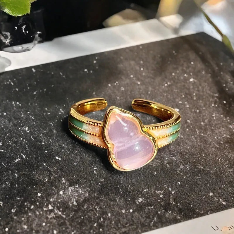 Adjustable gourd vintage ring with oil dripping finish in New Chinese style showing bow-shaped elements and zircon details
