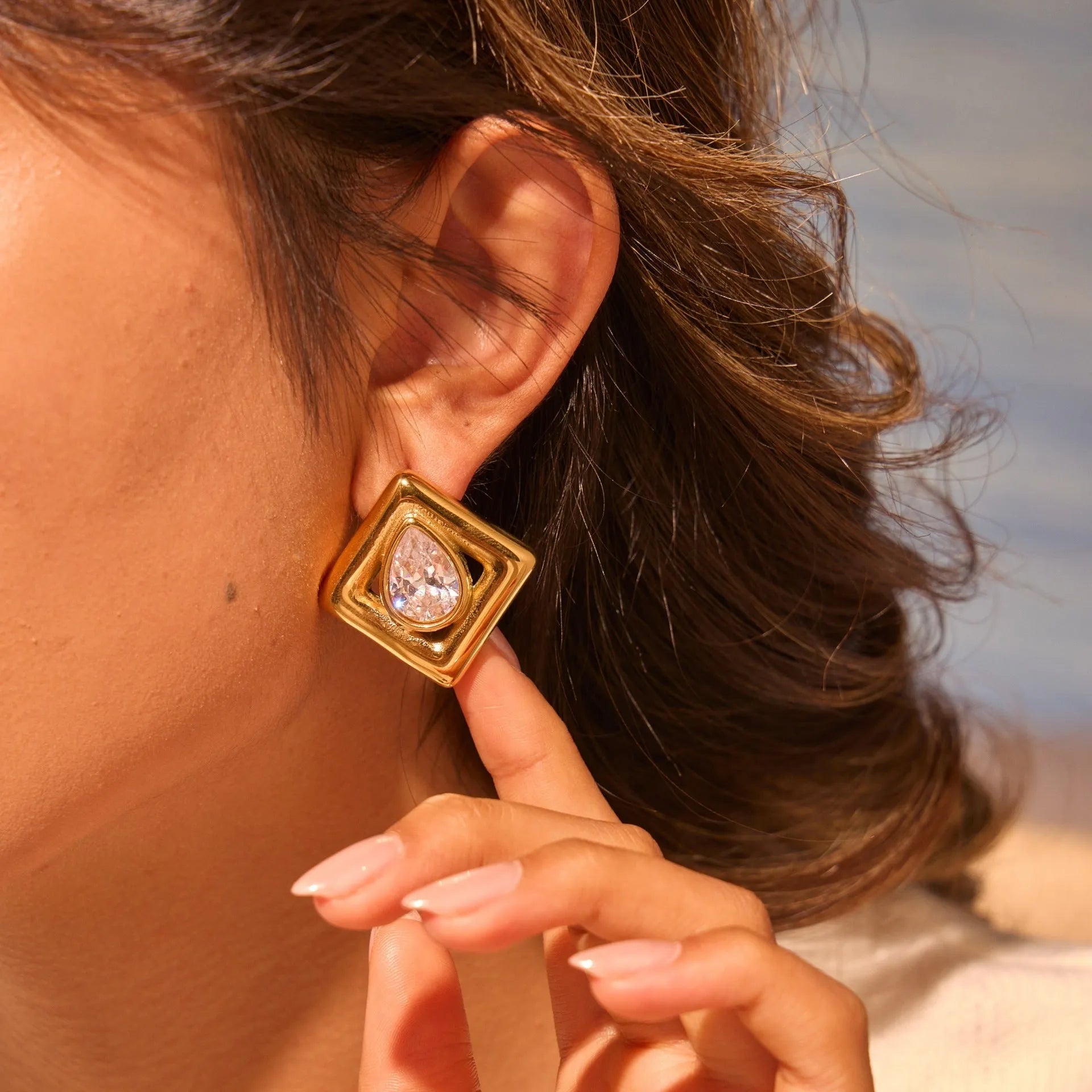 Gold geometric water drop stud earrings with inlaid zircon stones on stainless steel