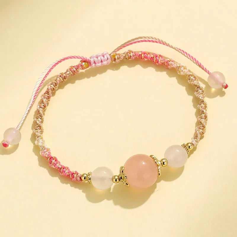 Hand-woven white agate and prehnite couple bracelet with 12mm diamond-shaped beads and electroplated finish on woman's wrist