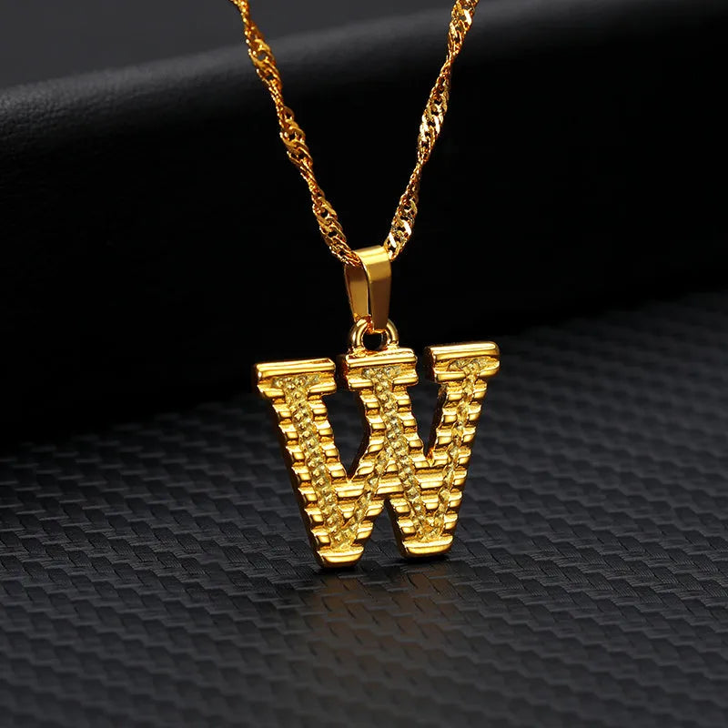 Gold-plated alloy initial pendant necklace with 42cm chain on white background