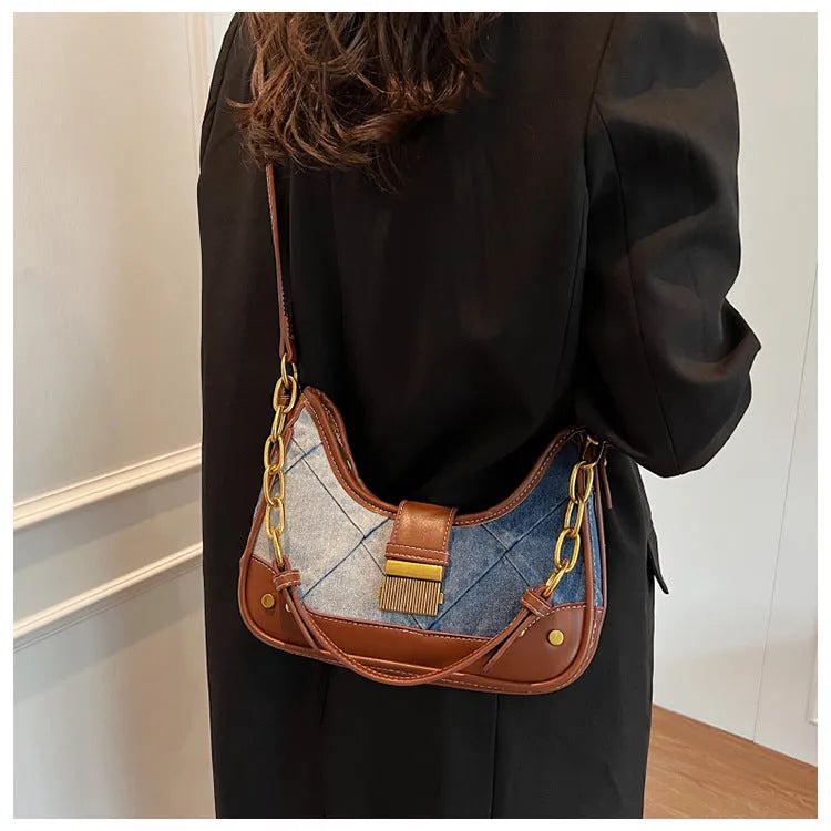 Women's brown denim shoulder bag with diamond chain accents and bucket shape design
