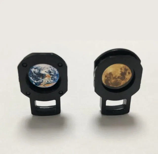 Earth and Moon LED projector lamp with adjustable rotating bracket on wooden surface