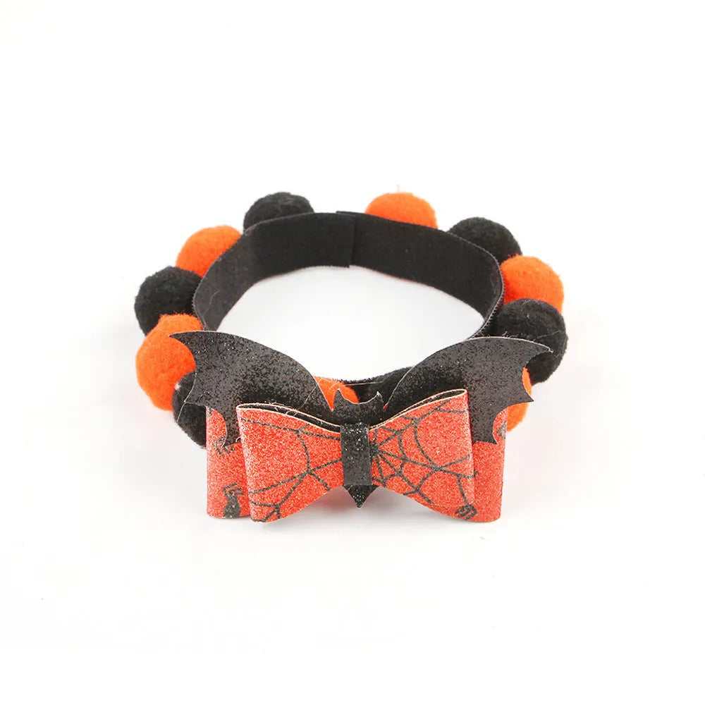 Halloween pet fur ball collar accessory for small dogs and cats in pumpkin, skull, and witch designs.