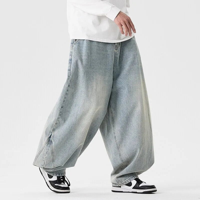 Men's plus size baggy jeans in dark blue denim with a straight leg and low waist.