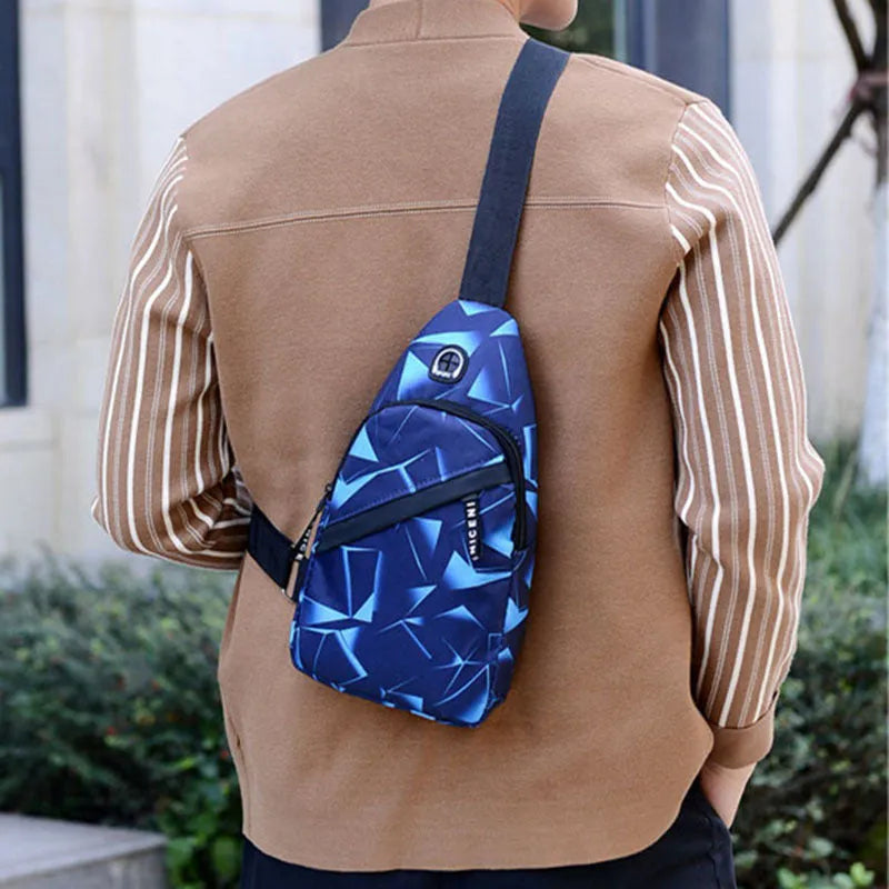 Blue Oxford cloth crossbody sling bag with earphone hole and zipper pocket.