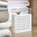White reusable cabinet dehumidifier box with transparent top showing colour-change indicator