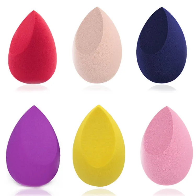 Assorted makeup sponges in seven shapes including pear and peach heart designs, 60x42mm, non-latex material