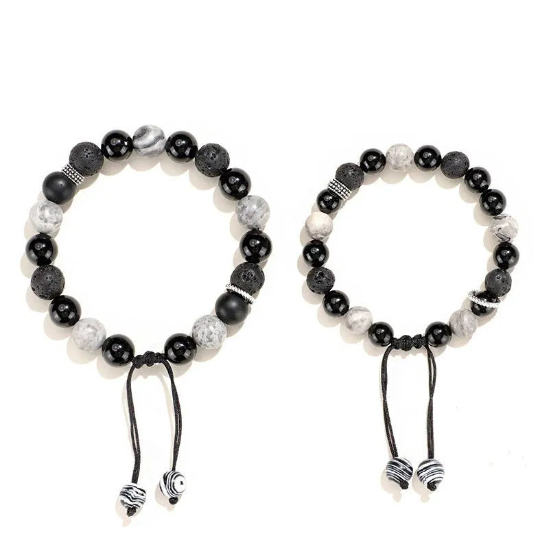 Black agate map stone volcanic rock bracelet in diamond shape, New Chinese style, on wrist.