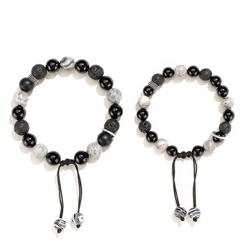Black agate map stone volcanic rock bracelet in diamond shape, New Chinese style, on wrist.
