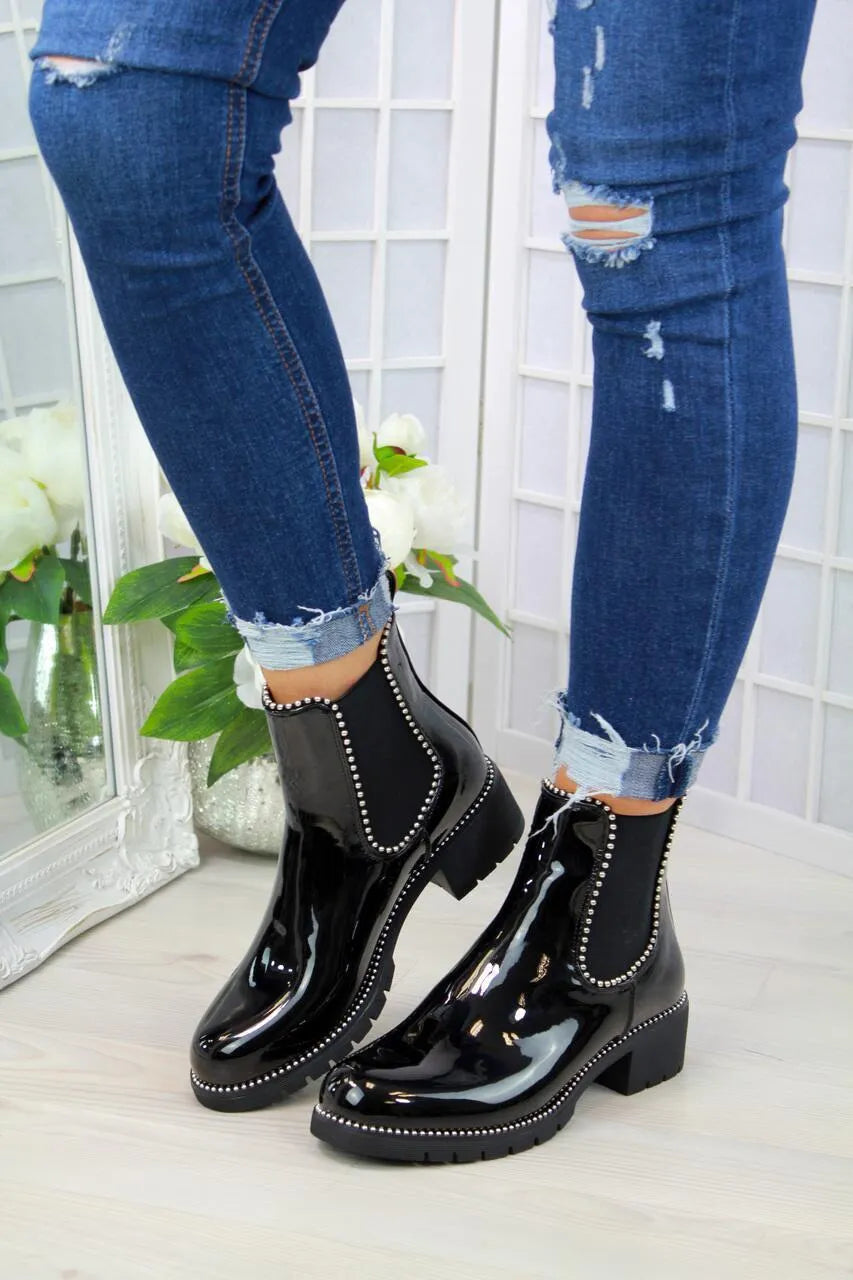 Women's short Martin boots in black PU sheep pattern with round toe and rubber sole