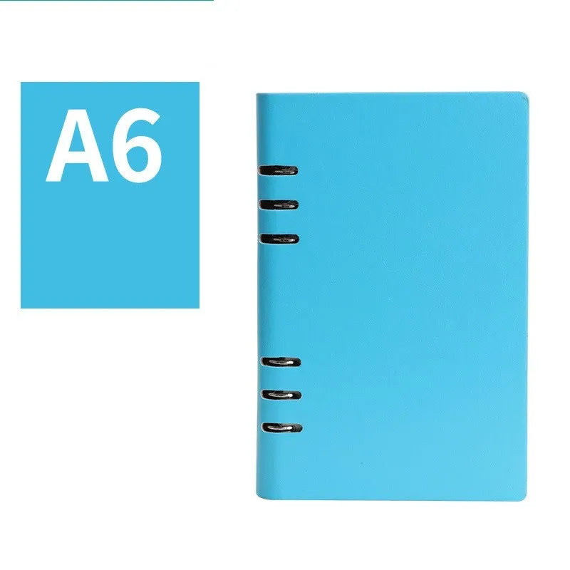Simple business notebook with imitation leather cover showing loose-leaf binding and beige road forest paper