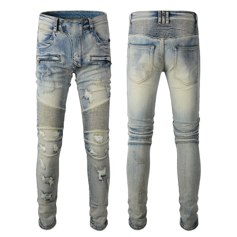 Light blue men's slim fit distressed jeans with hand-frayed detailing and a tapered leg.