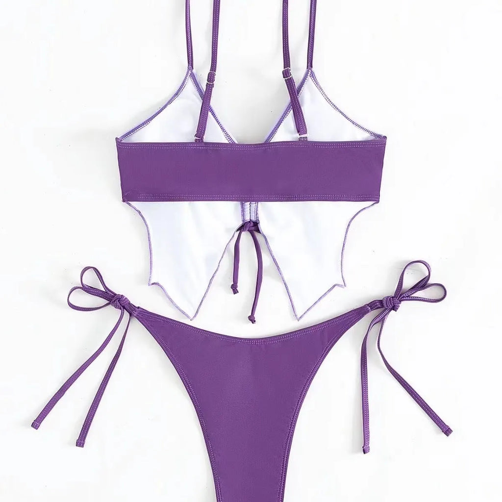 Women's purple bow ins style split bikini set with sleeveless top and briefs for swimming.