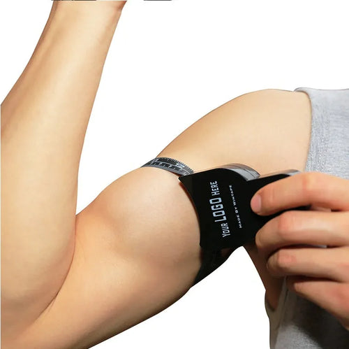 Black ABS body fat caliper with measurement scale and cable for skinfold thickness tracking
