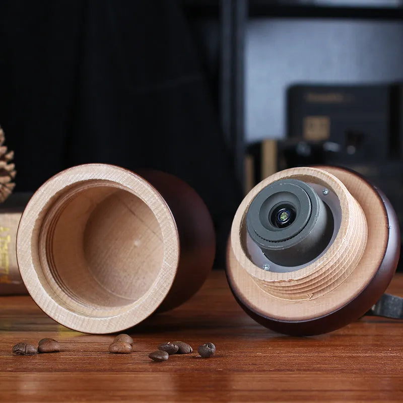 Solid wood barrel manual coffee grinder with hand crank in natural coffee colour