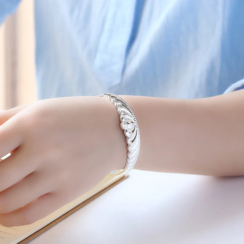 Silver electroplated crown bracelet for women on white background