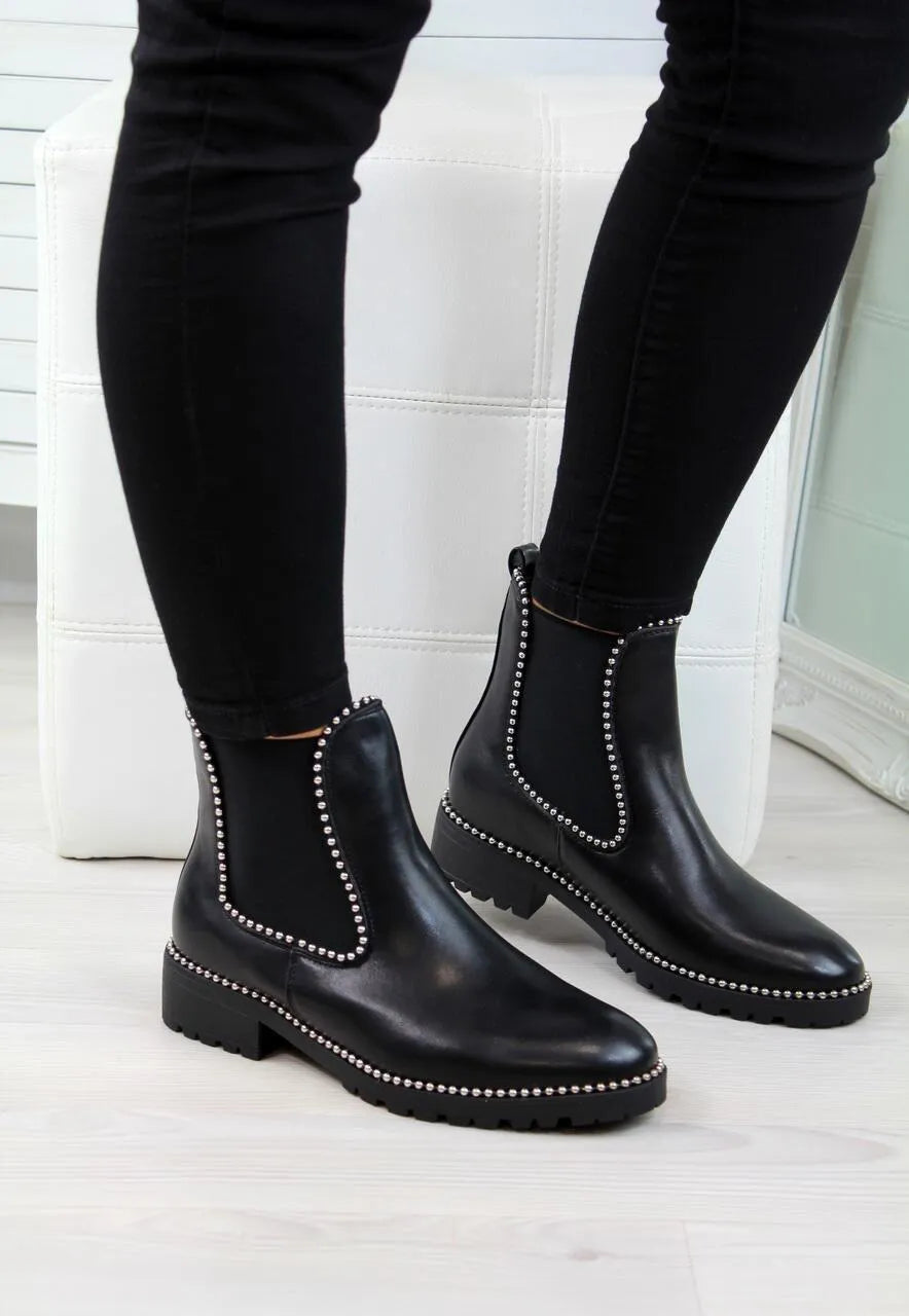 Women's short Martin boots in black PU sheep pattern with round toe and rubber sole