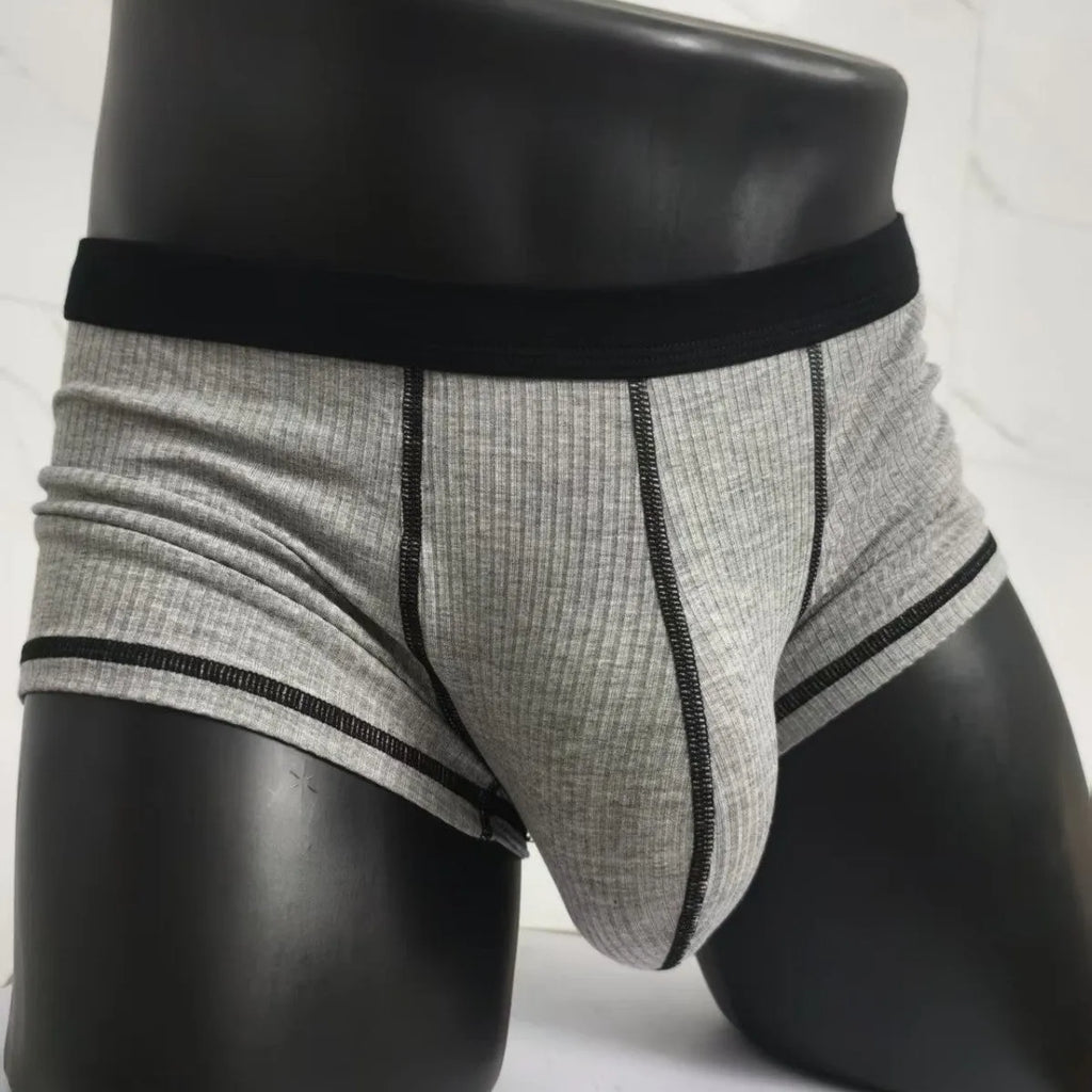 Solid colour men's boxers in breathable thin fabric offering hip lifting and body shaping support.
