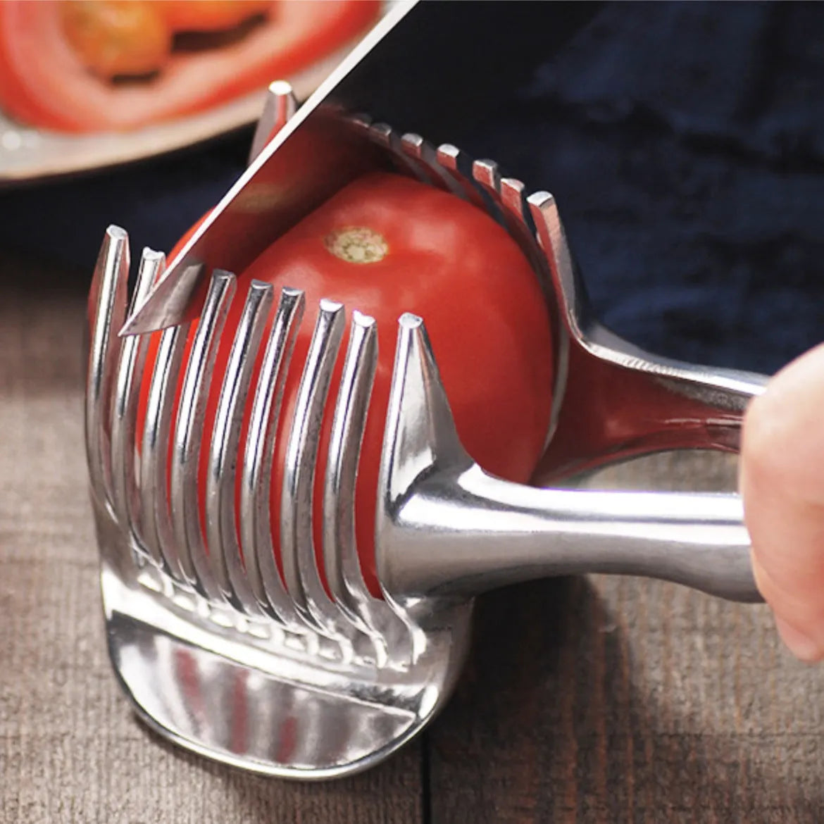 Silver plastic lemon slicer kitchen gadget on a cutting board