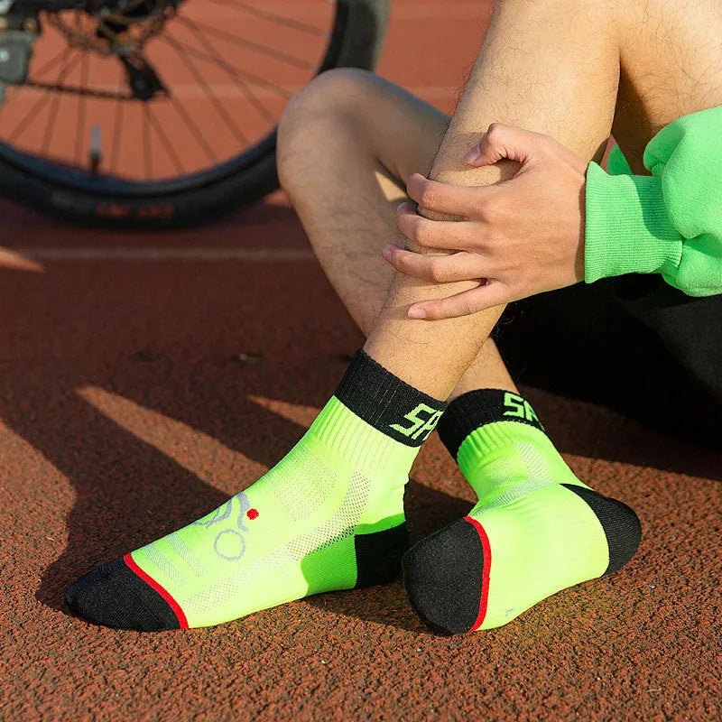 Set of professional outdoor nylon cycling and running socks in black, blue, green, orange and white colours, available in sizes M to XL