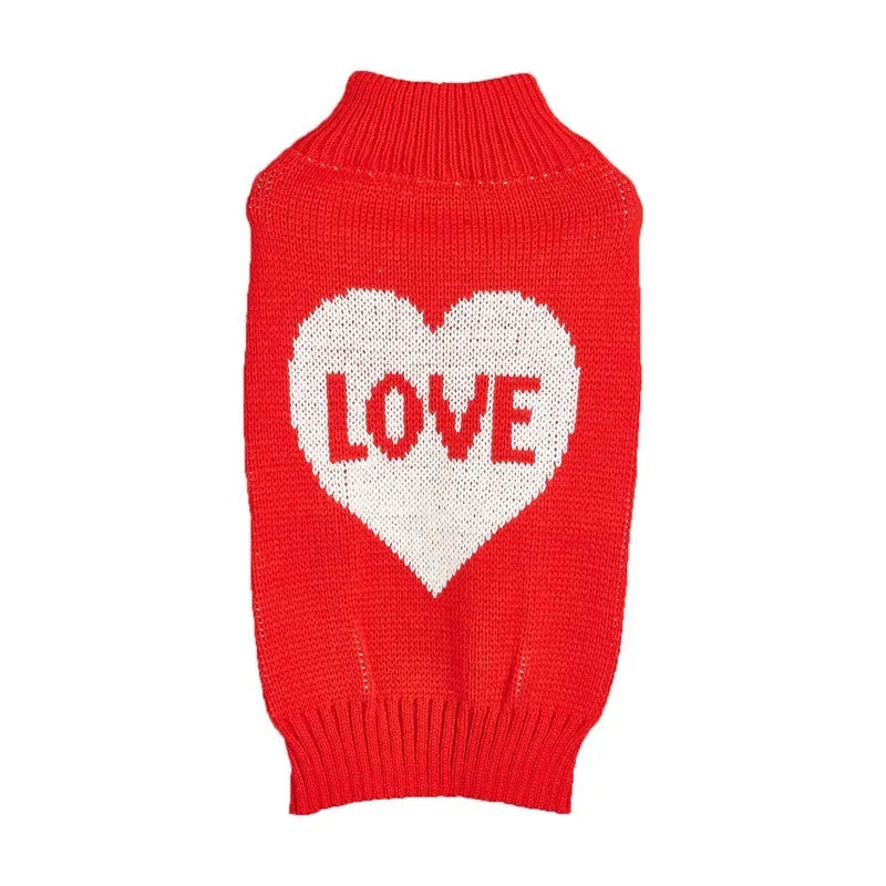Dog wearing red love heart patterned sweater in acrylic knit fabric