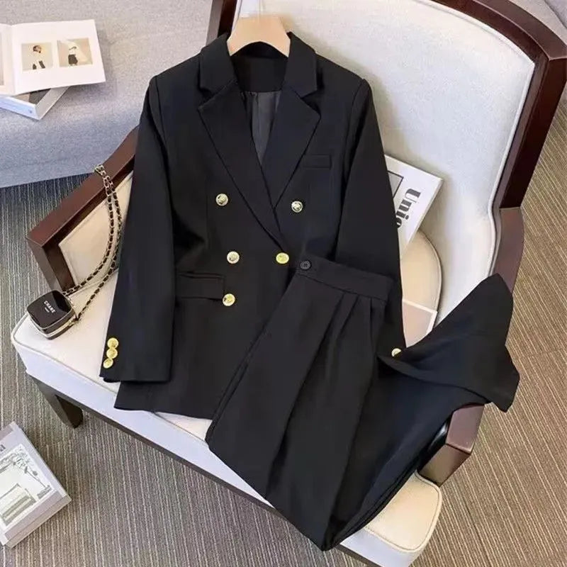 Women's loose black polyester blouse with regular sleeves on a hanger.