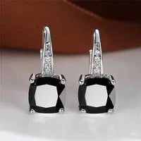 Square geometric ear hook studs with a round zircon stone, shown in a gold electroplated finish.