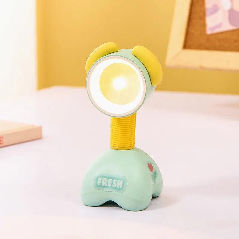 Cartoon animal magnetic night lamp with adjustable head on metallic surface
