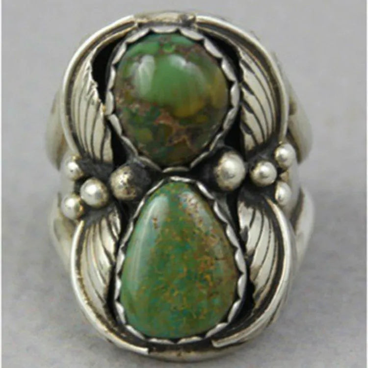 Turquoise geometric retro ring for women on a white background, showing inlaid design.