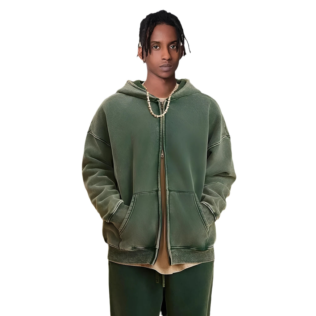 Man wearing a washed black hooded cardigan with a double zipper and fleece lining