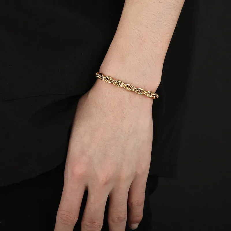Gold double colour twist chain titanium steel bracelet with geometric design on white background