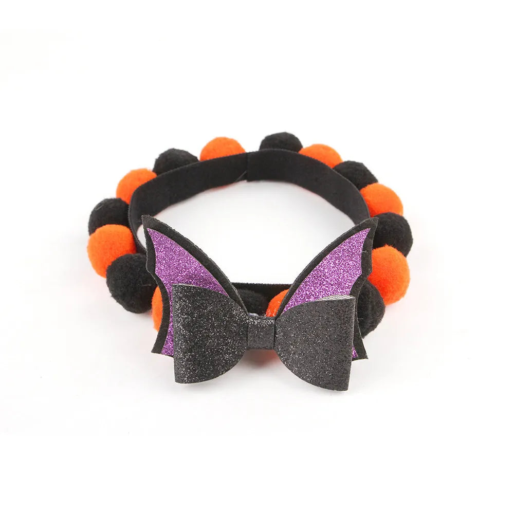 Halloween pet fur ball collar accessory for small dogs and cats in pumpkin, skull, and witch designs.