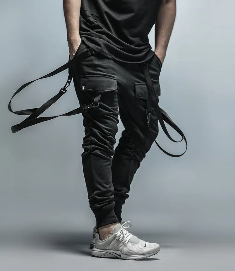 Black cotton blend men's hip hop pencil sweatpants with belt lying flat