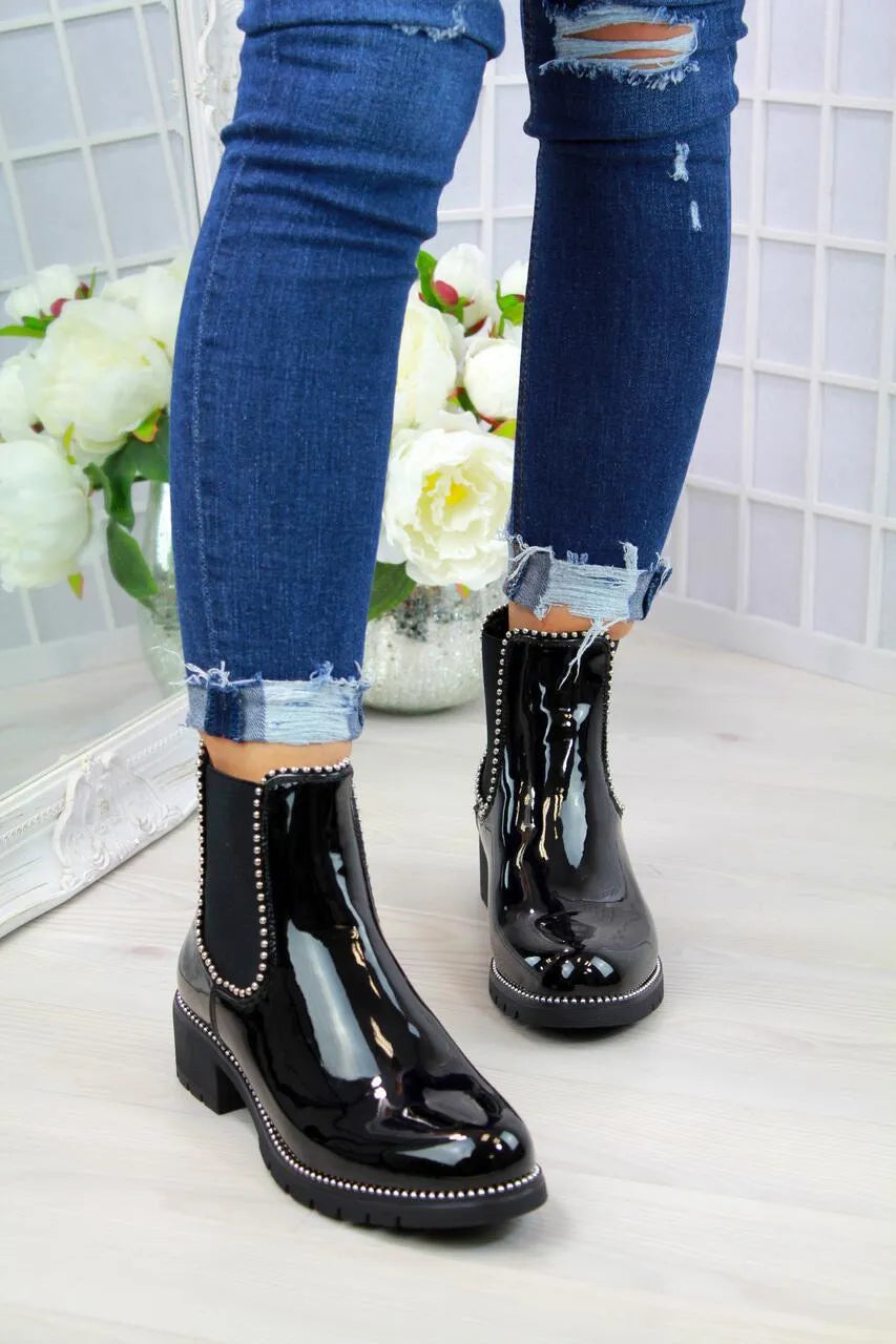 Women's short Martin boots in black PU sheep pattern with round toe and rubber sole